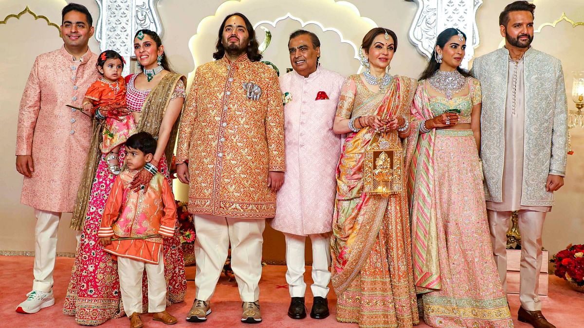 Designer duo Abu Jani-Sandeep Khosla's pastel hues dominated the Ambani family's attire, from father and oil-to-telecom conglomerate Reliance Industries chairman Mukesh, to mother Nita, sister Isha and her husband Anand Piramal, and brother Akash. Aakash's wife Shloka Metha was the only exception who wore a stunning hot pink lehenga adorned with crystals.