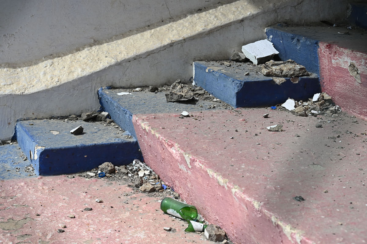 Broken bottles and crumbling infrastructure pictured on the steps of Bangalore Football Stadium’s Western stand. 