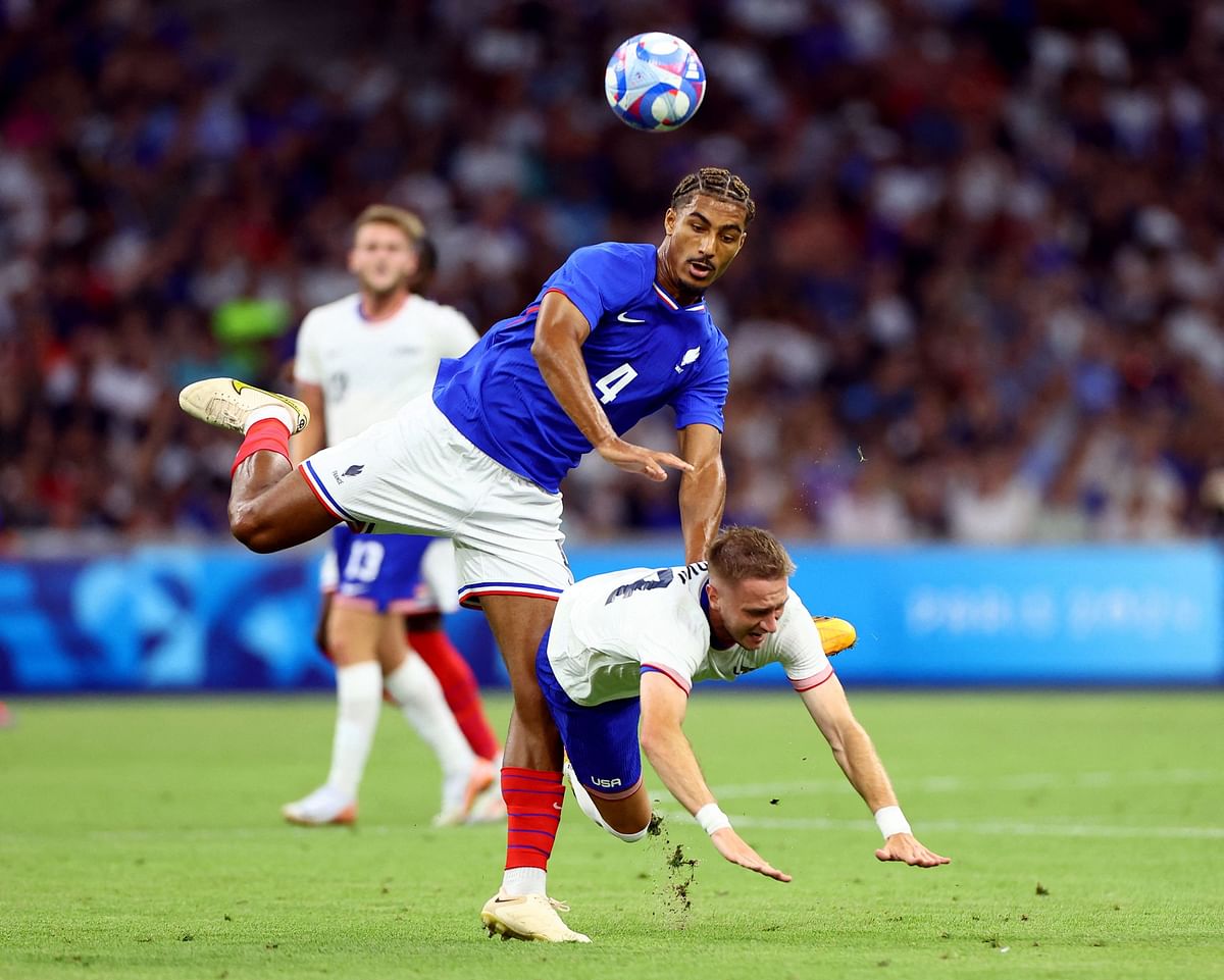 Loic Bade of France in action with Djordje Mihailovic of United States.