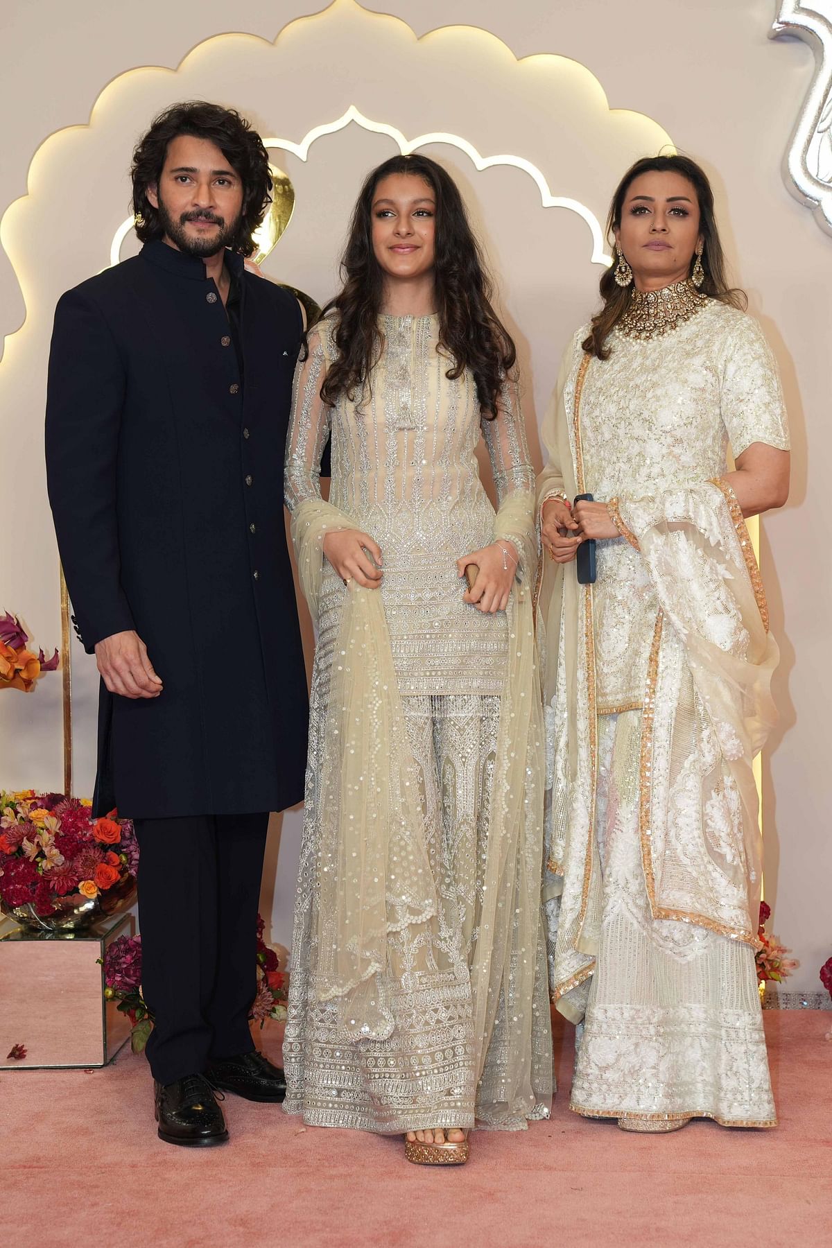 Tollywood prince Mahesh Babu poses with his daughter Sitara Ghattamaneni and wife Namrata Shirodkar as they arrive at Anant Ambani and Radhika Merchant's wedding.