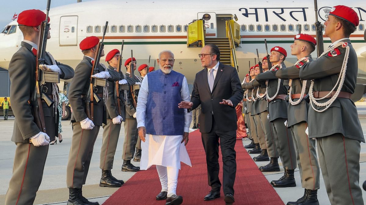 Prime Minister Narendra Modi being received by Austrian Foreign Minister Alexander Schallenberg upon his arrival at the airport in Vienna.