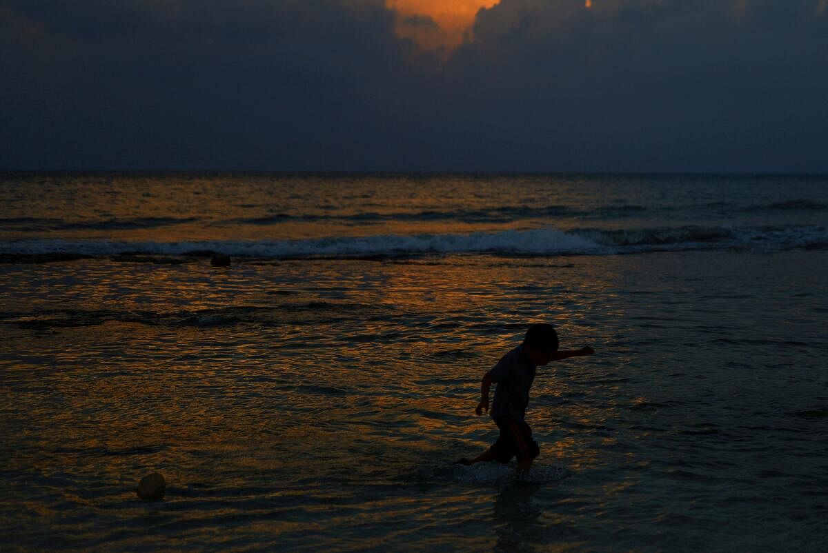 A child plays at a beach, ahead of the arrival of Hurricane Beryl, in Playa del Carmen, Mexico.