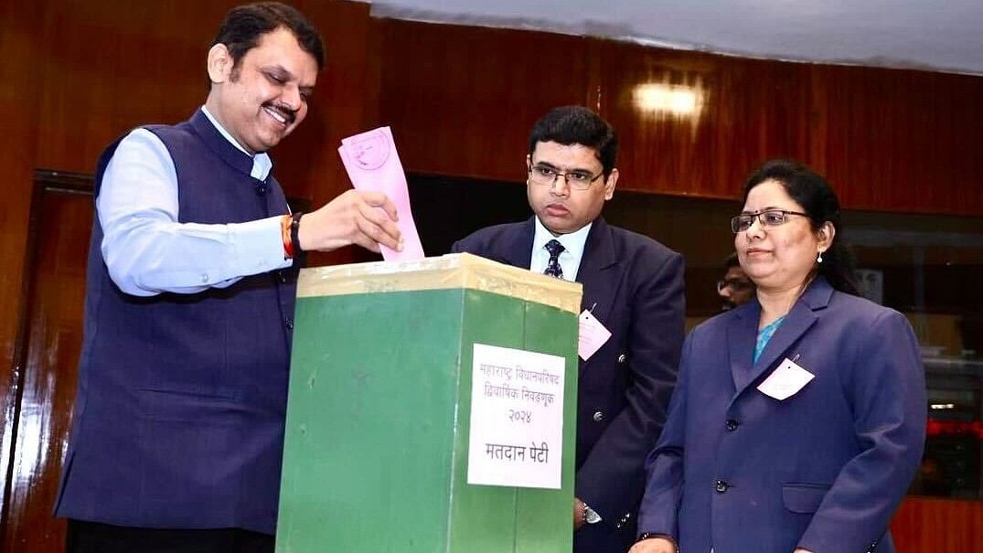  Maharashtra Deputy Chief Minister Devendra Fadnavis casts his vote for the State Legislative Council elections, in Mumbai. 