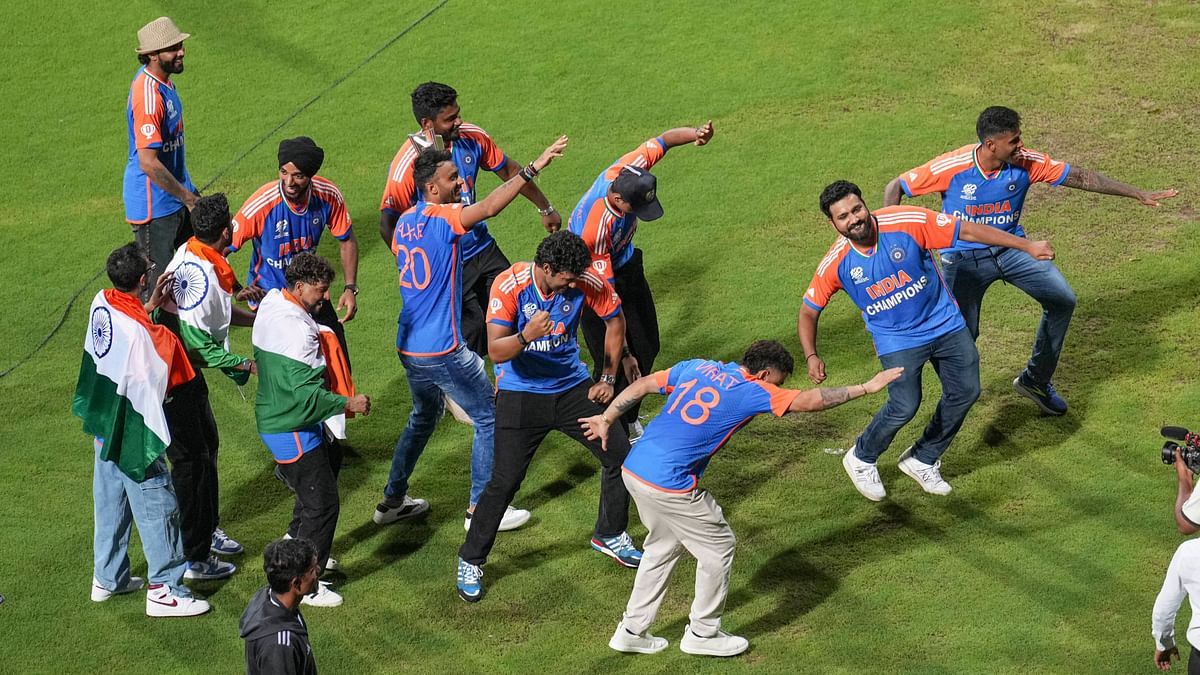 Indian cricketers groove to foot tapping numbers during their felicitation ceremony at the Wankhede Stadium, in Mumbai.