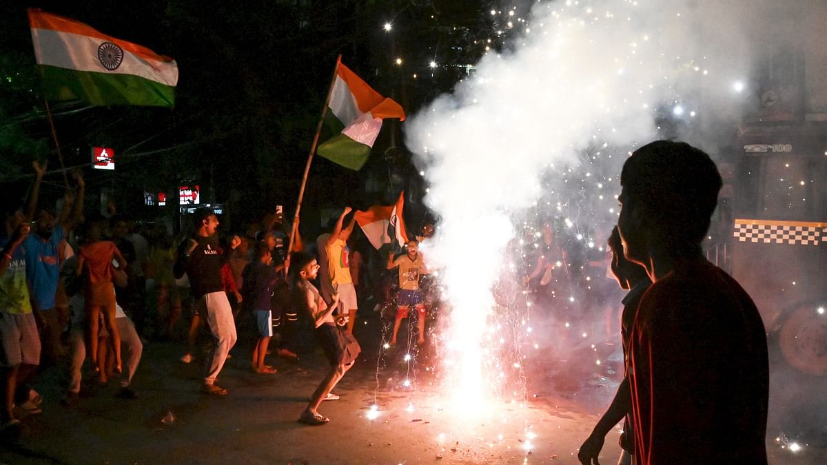 Fans celebrate in Kolkata after India won the ICC Men's T20 World Cup 2024.