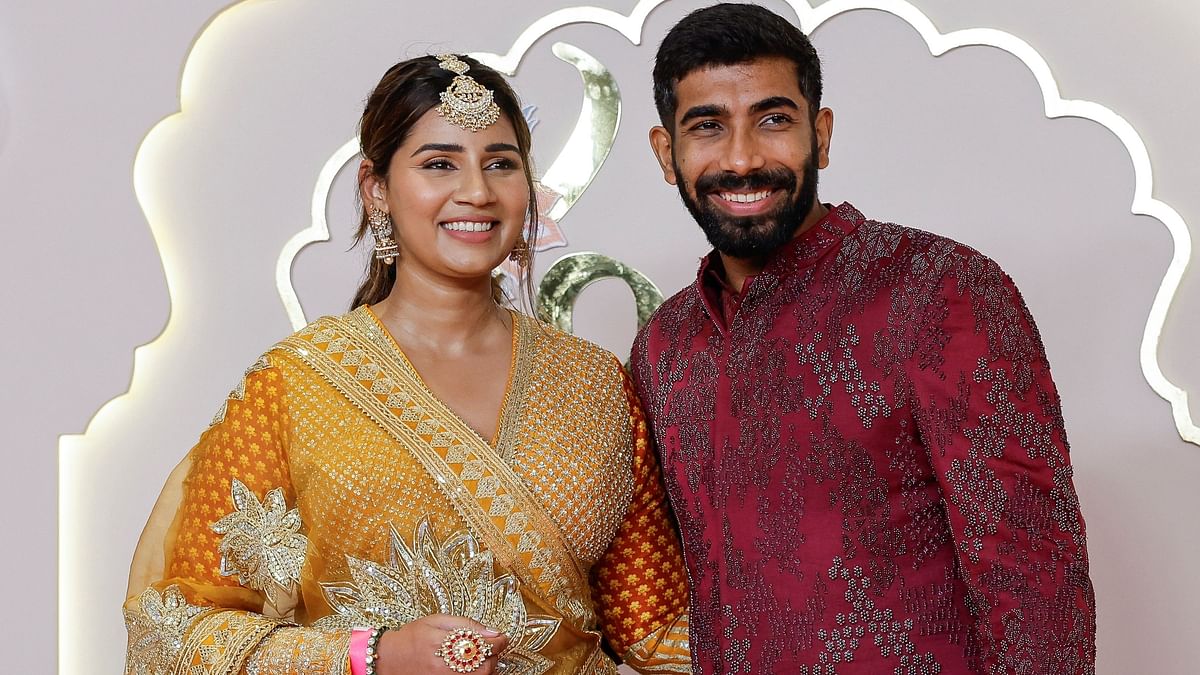 Cricketer Jasprit Bumrah and his wife Sanjana Ganesan are all smiles as they arrive for Anant Ambani and Radhika Merchant's wedding.