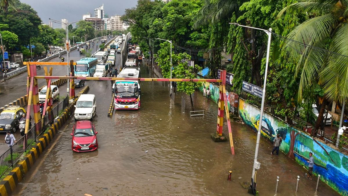 Vehicles in a waterlogged street in Mumbai.