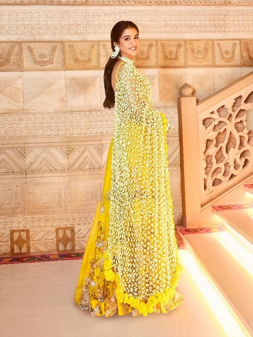 The dupatta, adorned with intricate floral motifs, was draped elegantly over her shoulders, enhancing the overall look.