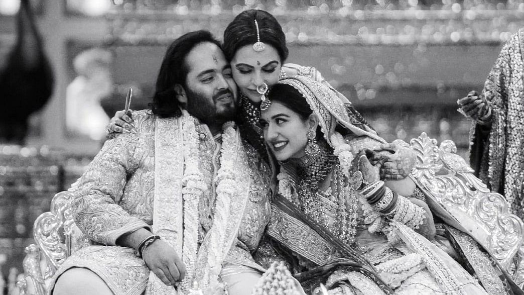 Nita Ambani hugs the newlyweds, Anant and Radhika.