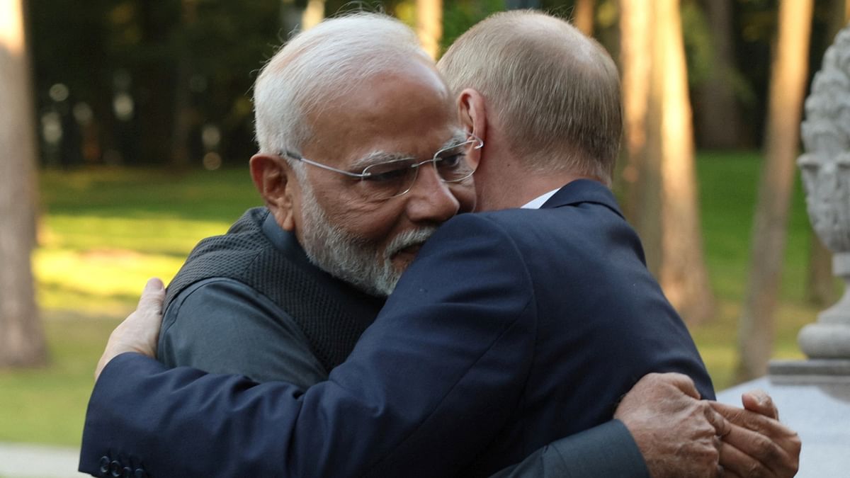 Vladimir Putin hugs Narendra Modi during their meeting at the Novo-Ogaryovo state residence near Moscow, Russia.