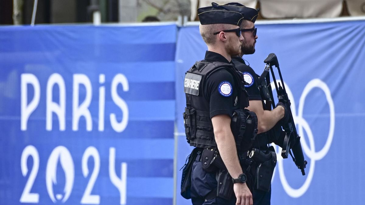 French policemen patrol amid preparations for the opening ceremony of the Paris 2024 Olympic Games in Paris.