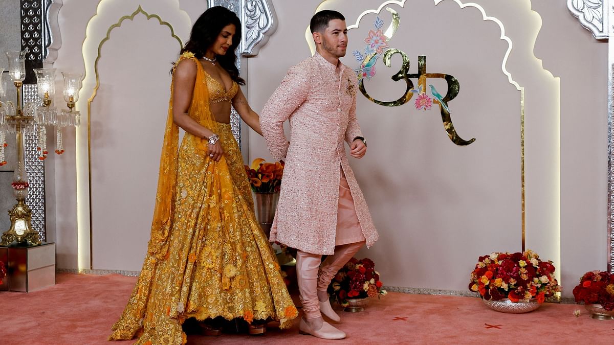 Priyanka arrived in a yellow lehenga choli with minimalised accessories. While Nick Jonas wowed in a pink sherwani.