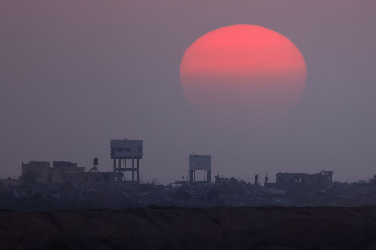 The sun sets over central Gaza, amid the conflict between Israel and Hamas, as seen from Israel, July 25, 2024.