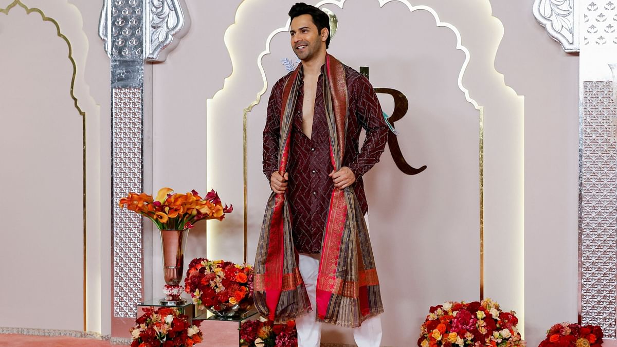 Varun Dhawan strikes a pose on his arrival for Anant Ambani and Radhika Merchant's wedding.