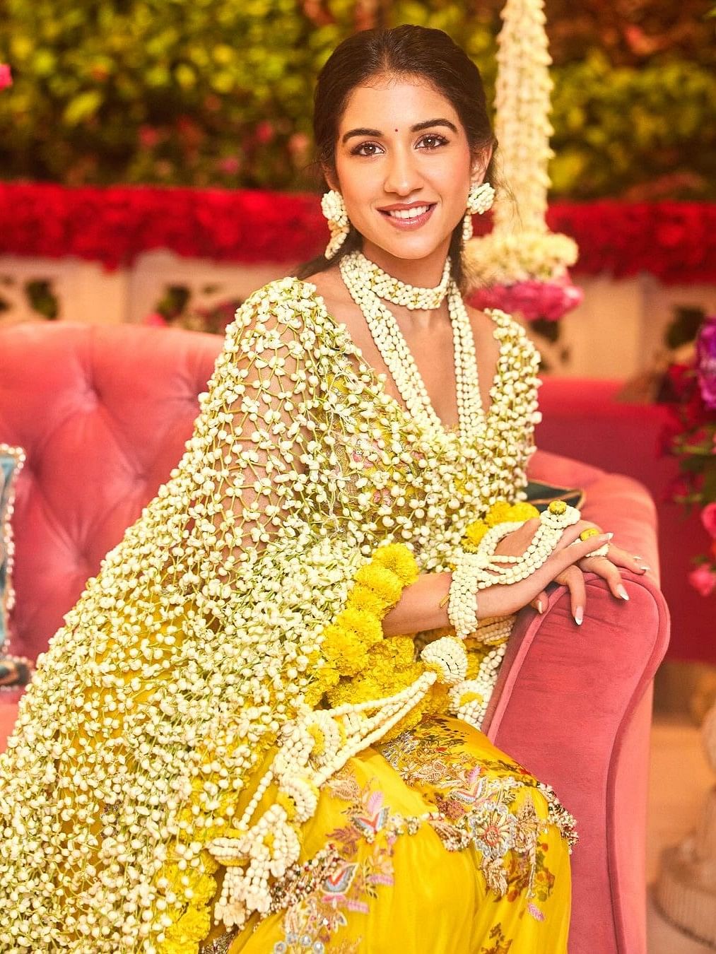 The bright yellow hue perfectly complemented her radiant complexion, making her the epitome of bridal grace.