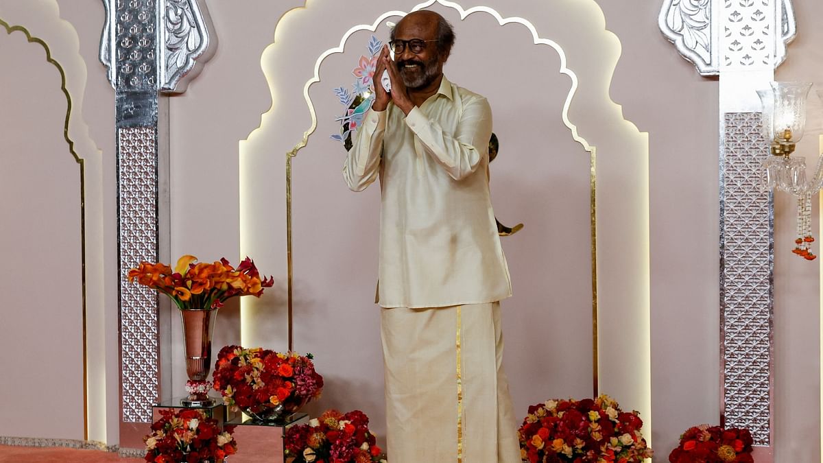 Superstar Rajinikanth gestures as he arrives for Anant Ambani and Radhika Merchant's wedding.