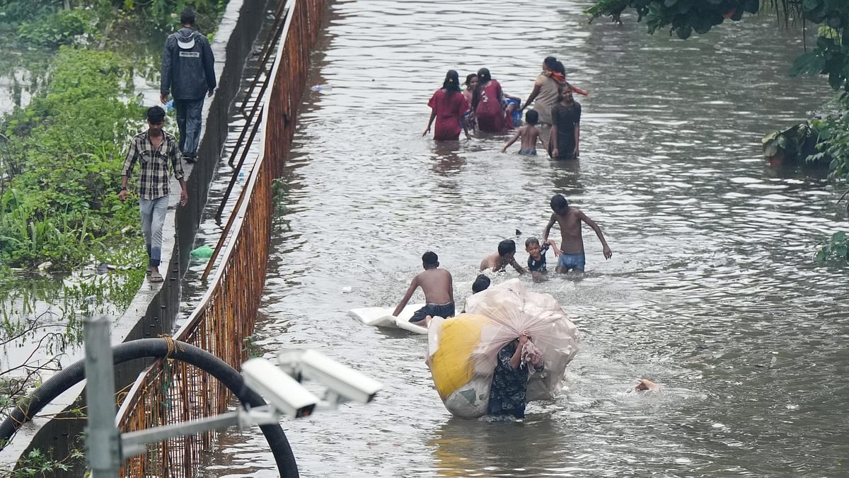 People could be seen wading through knee-deep and waist-deep water and vehicles including two-wheelers and four-wheelers were submerged.