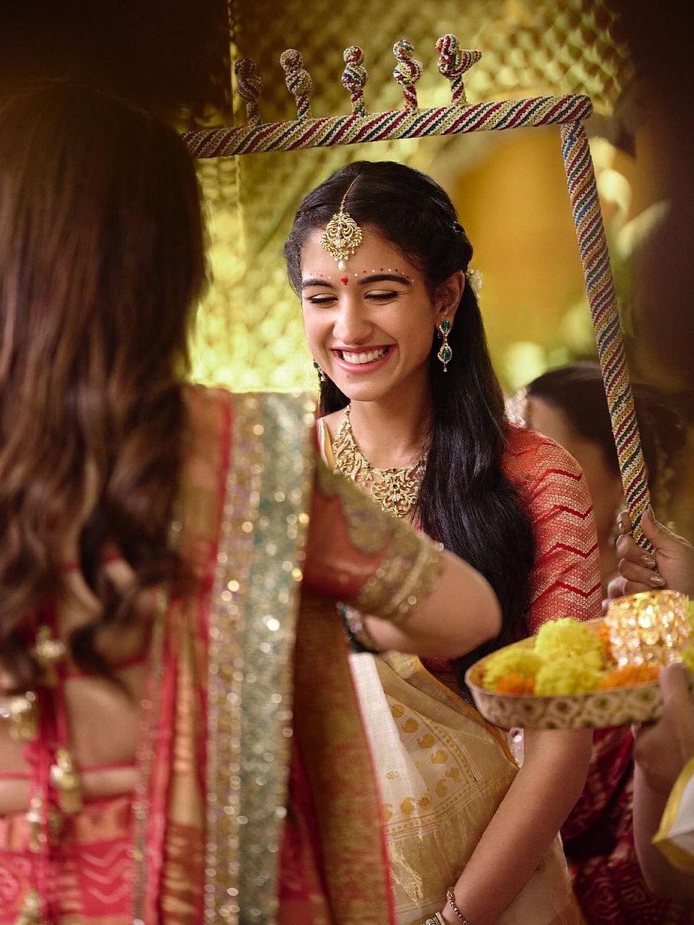 Radhika Merchant is all smiles during a  ritual from her pre-wedding festivities.