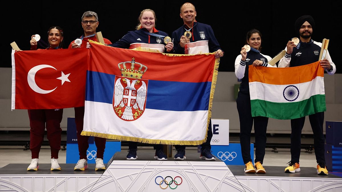 Silver medallists Sevval Ilayda Tarhan of Turkey and Yusuf Dikec of Turkey, Gold medallists Zorana Arunovic of Serbia and Damir Mikec of Serbia, and Bronze medallists Manu Bhaker of India and Sarabjot Singh of India pose on the podium.