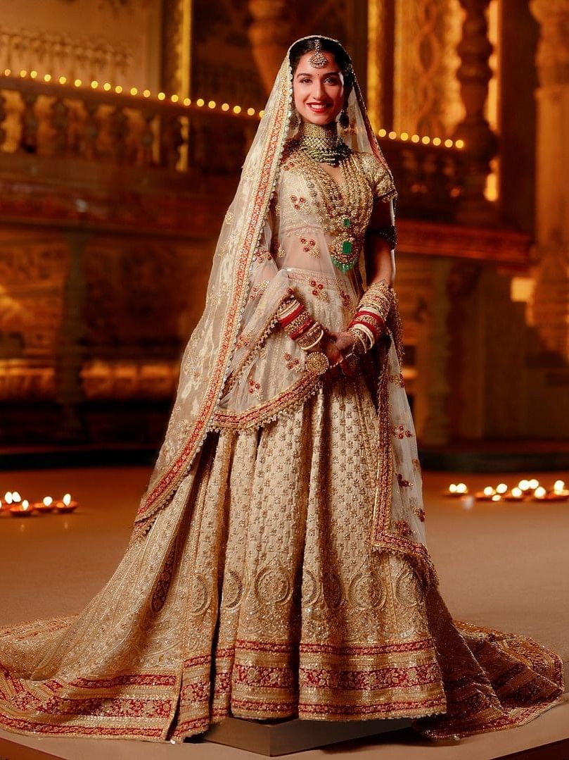 Radhika Merchant looked nothing short of a dream in her stunning wedding attire designed by the celebrated duo Abu Jani and Sandeep Khosla.