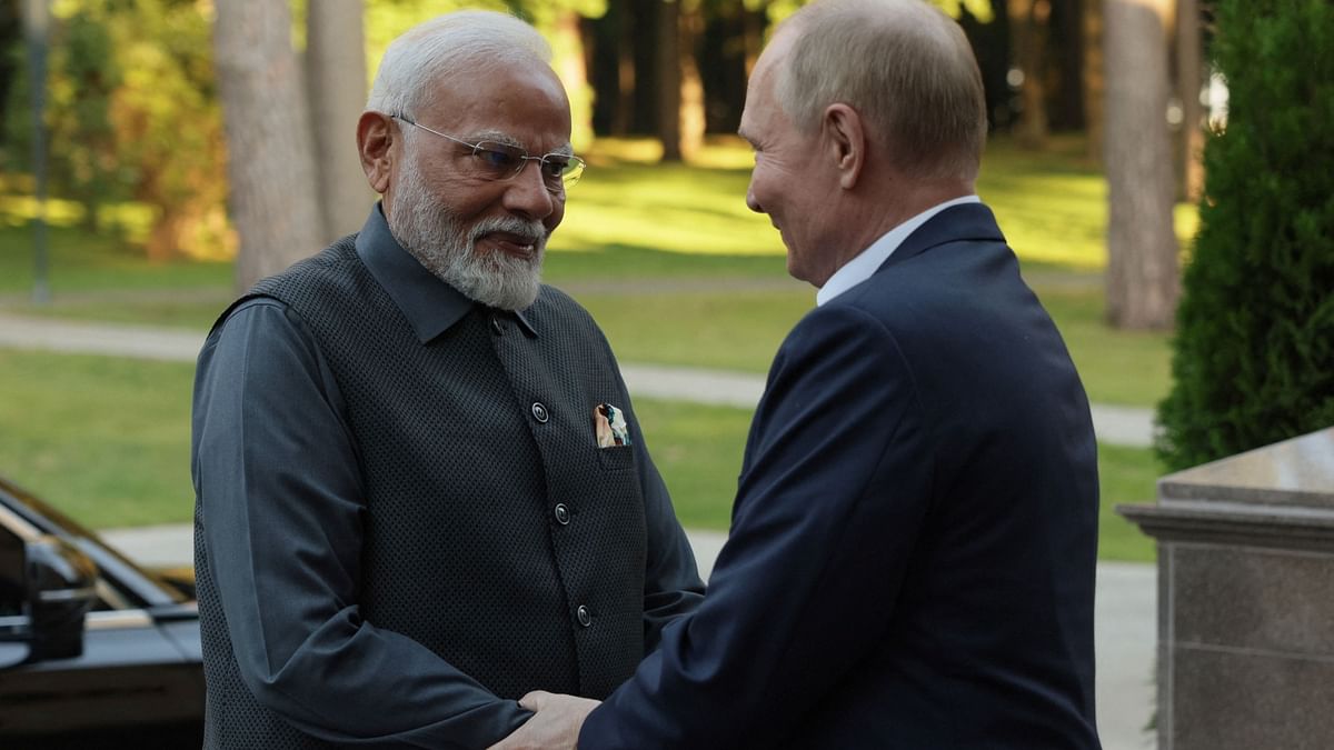 Prime Minister Narendra Modi shakes hand with Vladimir Putin as he arrives at the latter's residence near Moscow, Russia.