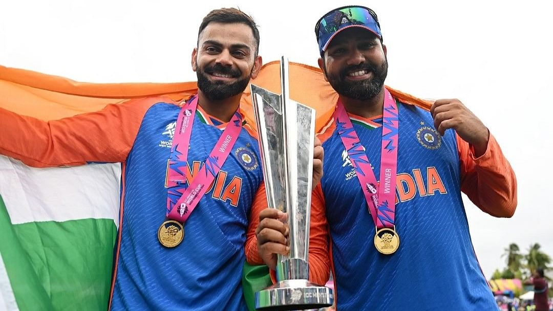 Virat Kohli and Rohit Sharma pose with the T20 World Cup trophy.