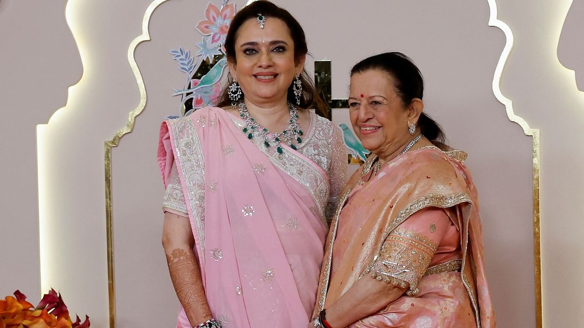 Mamta Dalal and Purnima Dalal pose for pictures on the red carpet on the day of the wedding of Anant Ambani and Radhika Merchant in Mumbai.