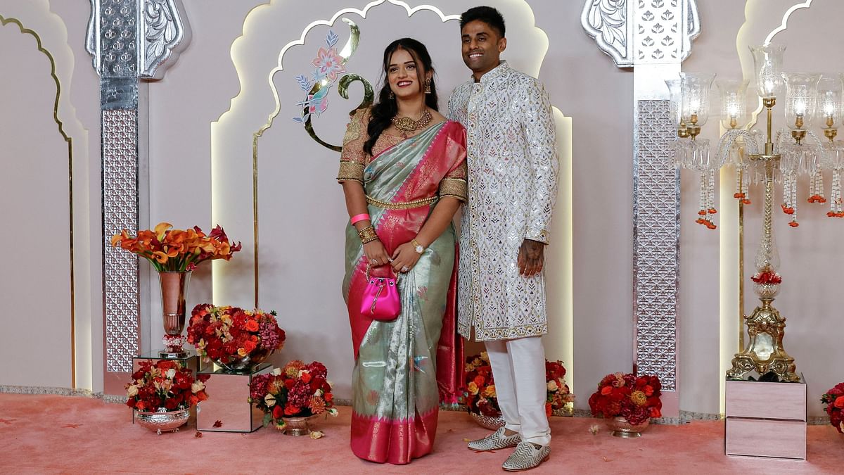 Cricketer Suryakumar Yadav and his wife Devisha Shetty pose on their arrival.