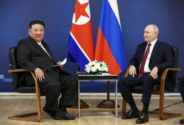 Russia's President Vladimir Putin (R) and North Korea's leader Kim Jong Un (L).