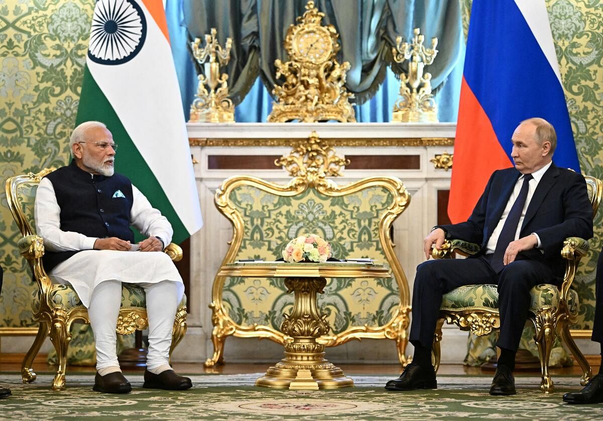 Russia's President Vladimir Putin (R) and India's Prime Minister Narendra Modi (L) attend a meeting at the Kremlin in Moscow, Russia.