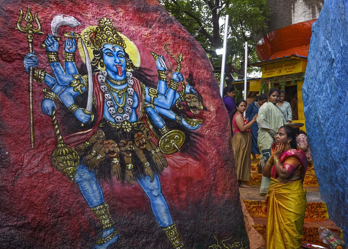 Devotees visit the Golconda Fort ahead of the ‘Ashada Bonalu’ festival, in Hyderabad. 