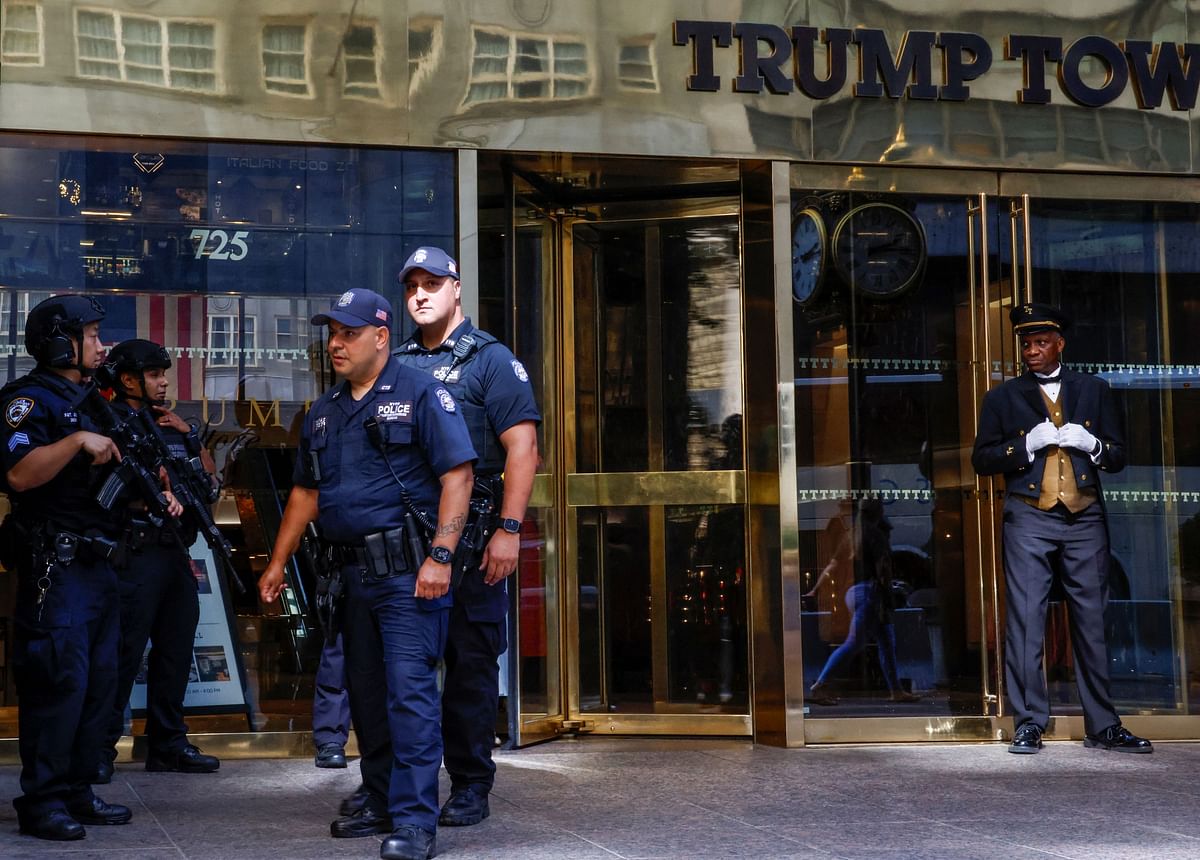 Police officers stand guard at Trump Tower after former US President Trump was injured during a campaign rally, in New York