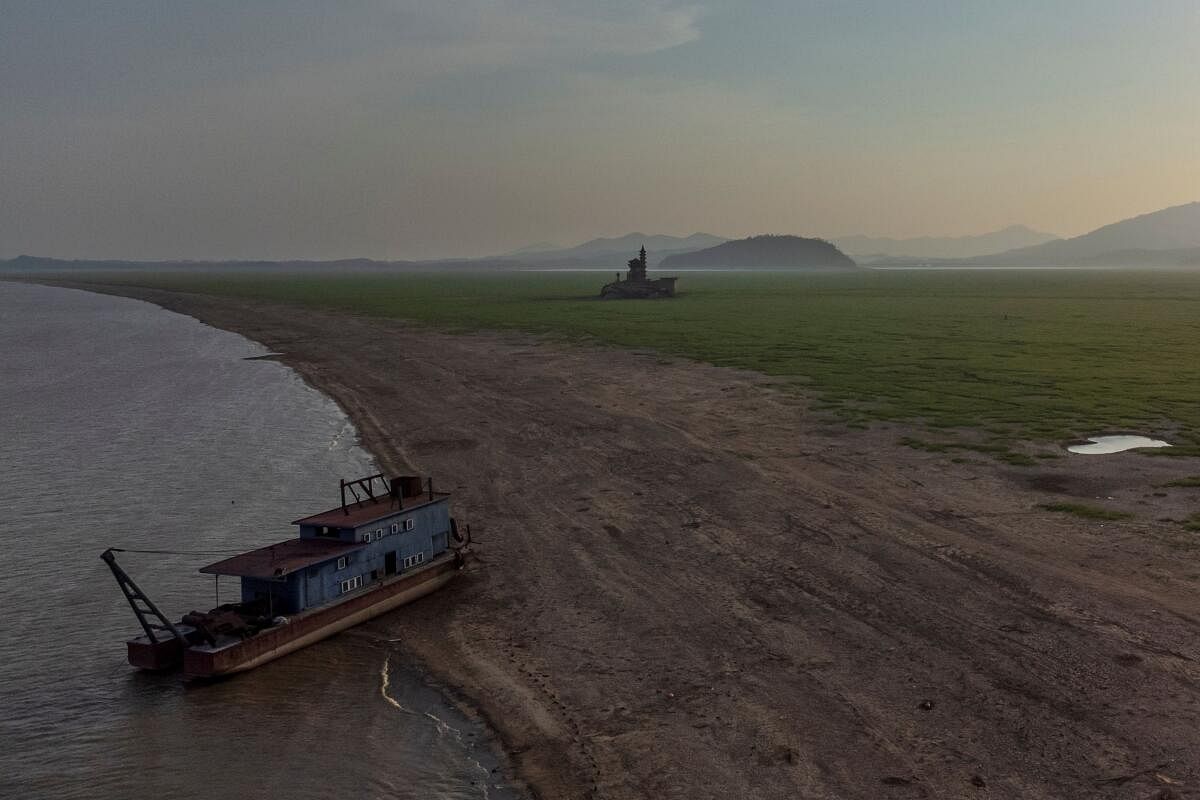 An aerial view shows a grounded ship near Luoxingdun island in Poyang Lake which exhibits low water levels because of a regional drought in Lushan, Jiangxi province, China.