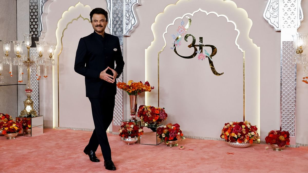 Anil Kapoor looks dapper in black bandhgala suit.