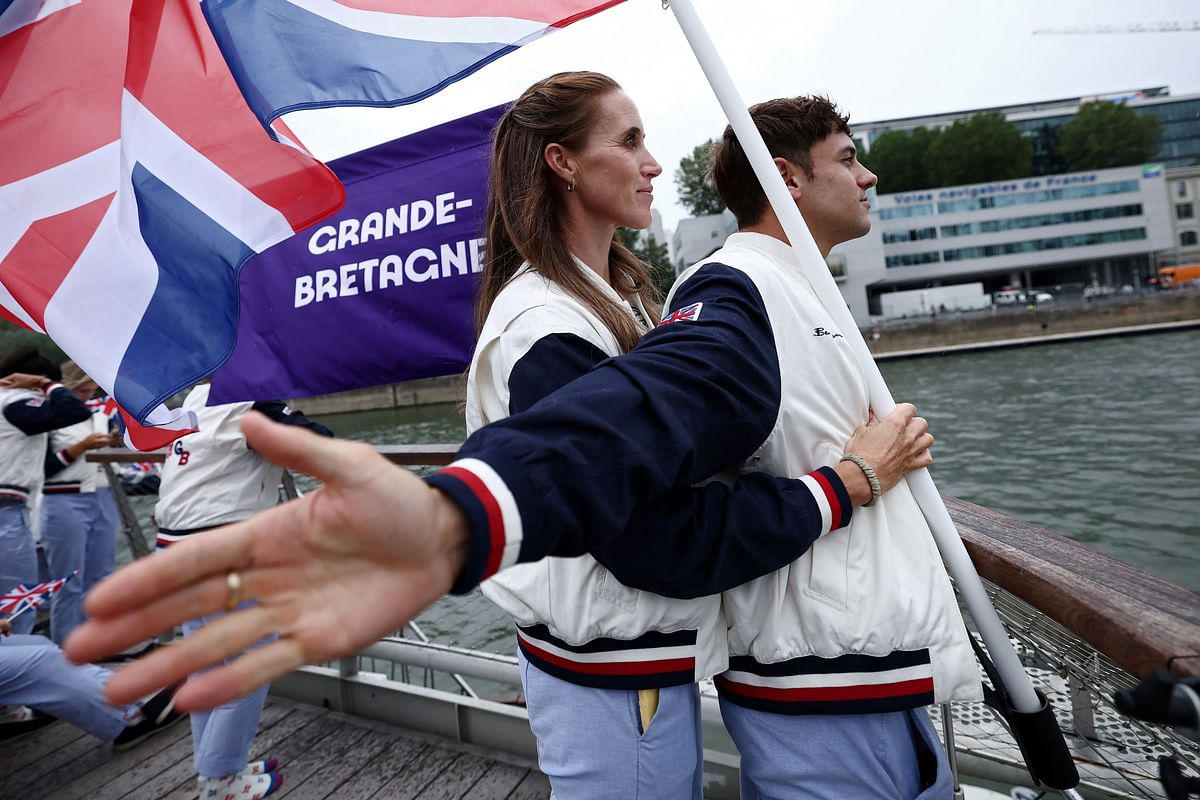 Flagbearers of Britain pose during the opening ceremony of the Olympic Games Paris 2024.