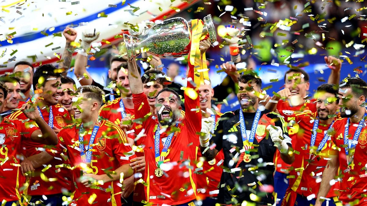 Spain's Dani Carvajal  with the team after winning Euro 2024.