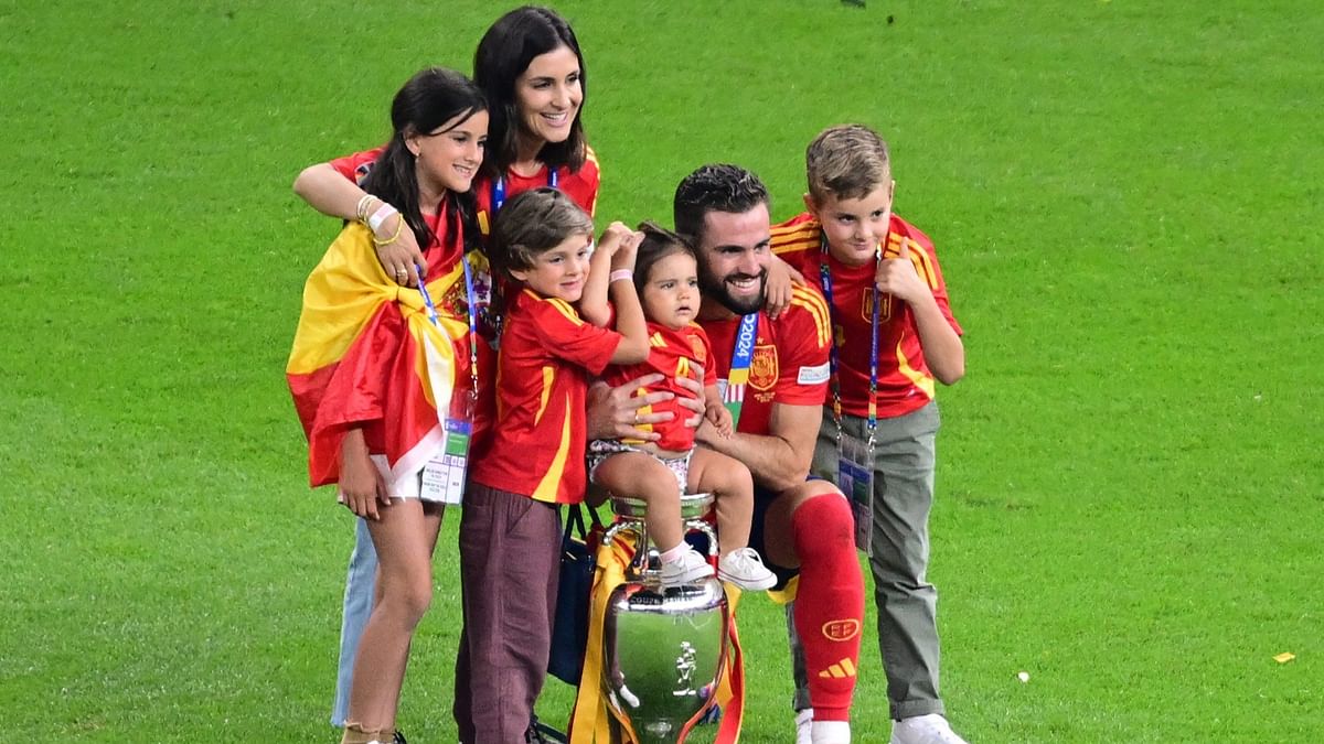 Spain's Nacho and his family pose with the trophy.