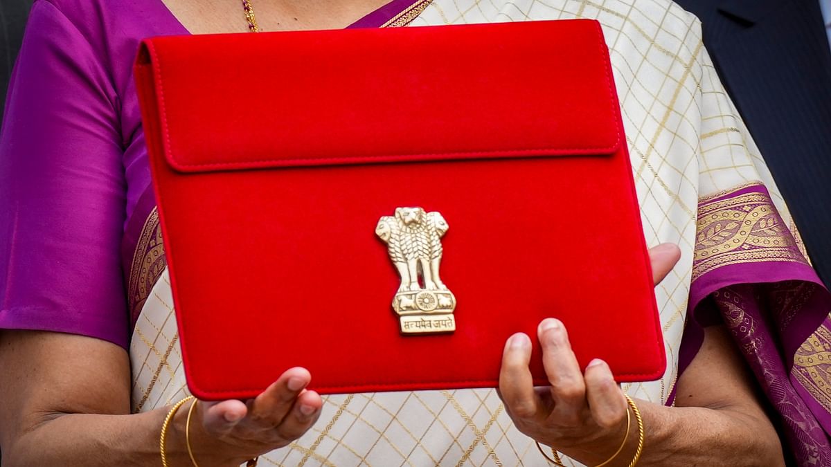 The tablet is inside a red cover with a golden-coloured national emblem embossed on it.