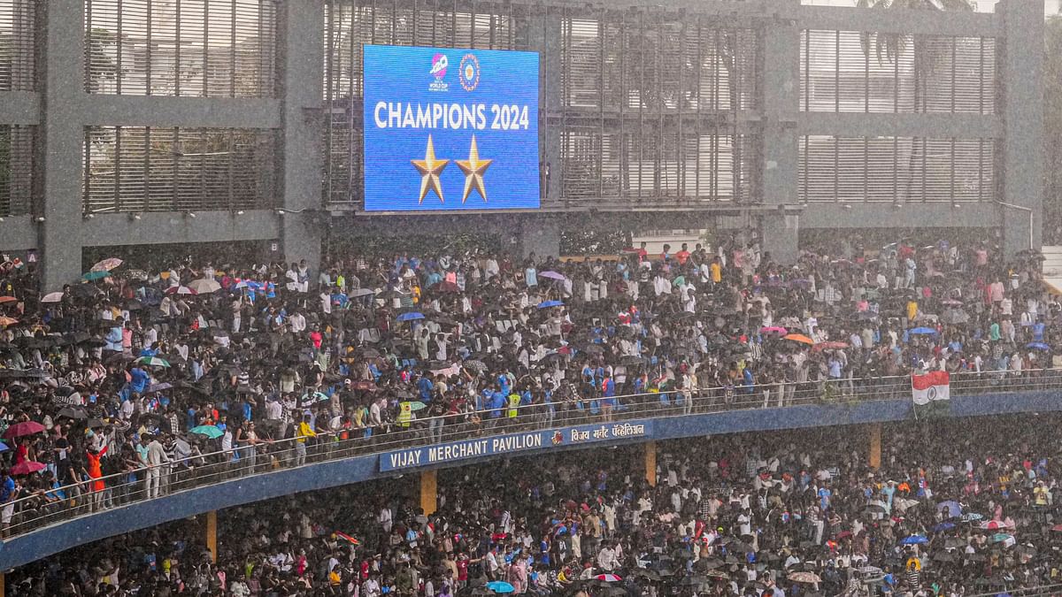 Fans cheer for team India at the Wankhede Stadium during their felicitation ceremony, in Mumbai.