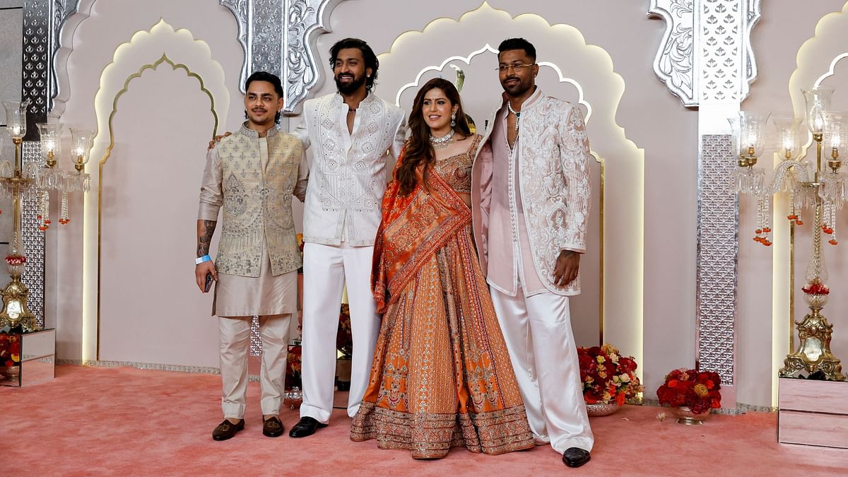 Ishan Kishan, Krunal Pandya, Pankhuri Sharma and Hardik Pandya pose for a photo on their arrival.