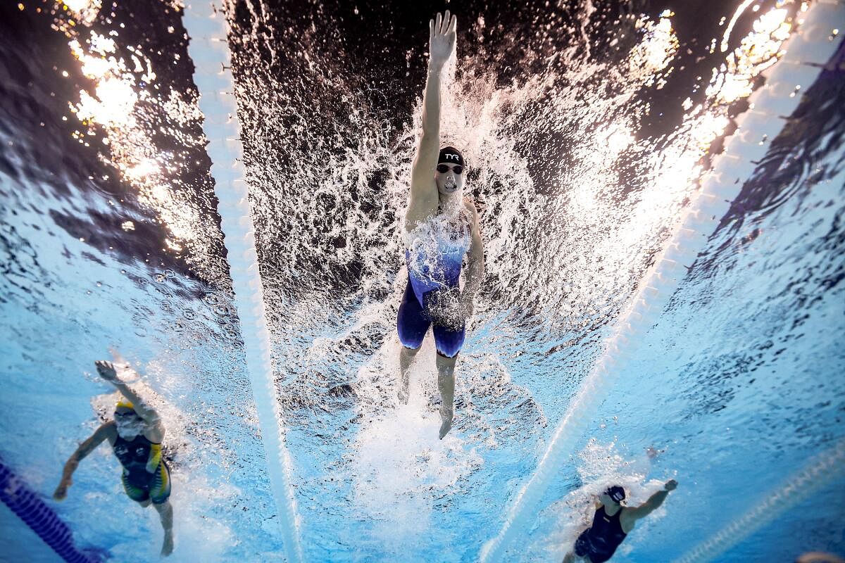 Paris 2024 Olympics - Swimming - Women's 800m Freestyle Final - Paris La Defense Arena, Nanterre, France - August 03, 2024. Katie Ledecky of United States, Ariarne Titmus of Australia and Paige Madden of United States in action.