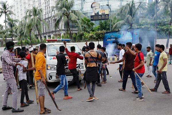 Demonstrators stop an ambulance to check whether there are any patients inside before allowing it to leave during a protest demanding the stepping down of Bangladeshi Prime Minister Sheikh Hasina, following quota reform protests by students, in Dhaka, Bangladesh, August 4, 2024.