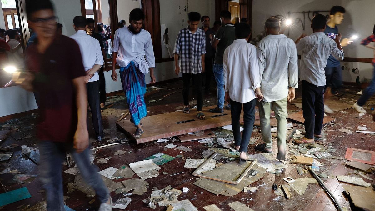 People search for items to loot at the Ganabhaban,  after the resignation of PM Sheikh Hasina in Dhaka, Bangladesh.