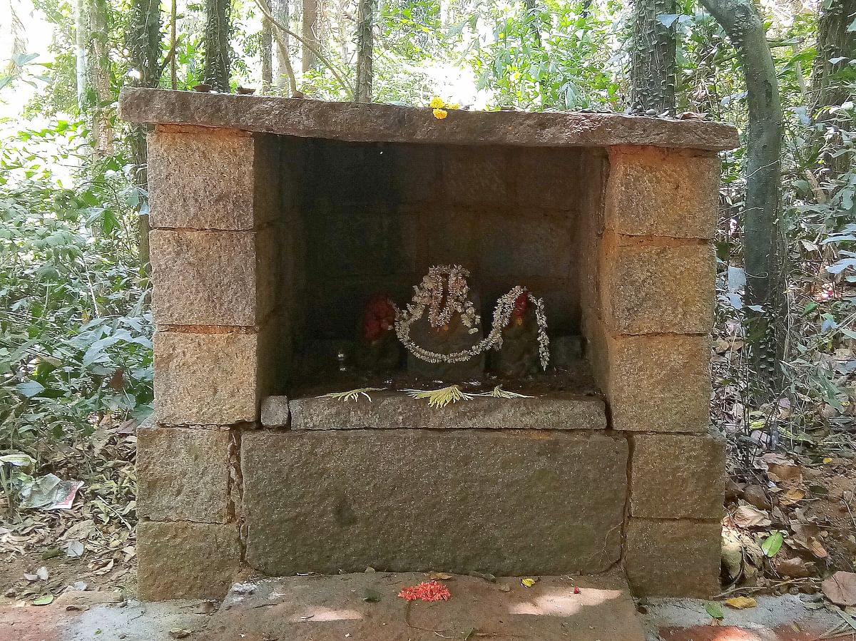 The deity on a stone pedestal in a