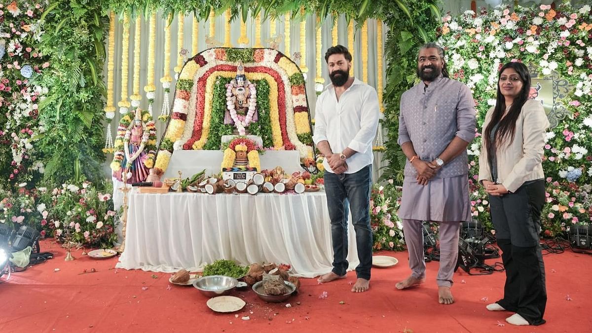 Rocking star Yash poses with producer Venkat K Narayana and director Geethu Mohandas during the movie Mahurat in Bengaluru.