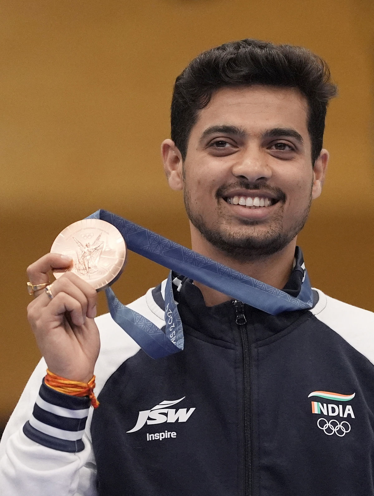 Bronze medallist Swapnil Kusale of India poses with his medal.