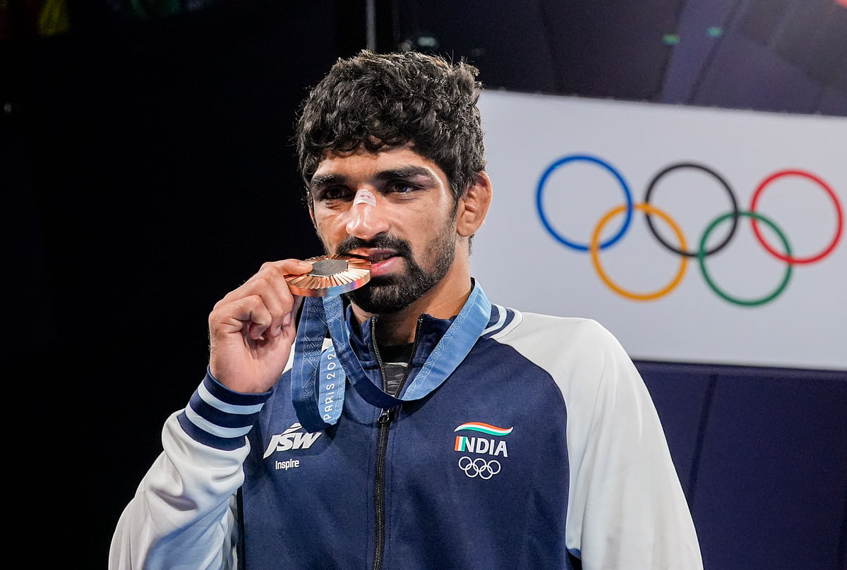 Bronze medalist India’s Aman Sehrawat poses for photos during the medal ceremony for the men's 57kg free-style wrestling event at the 2024 Summer Olympics, in Paris, France.