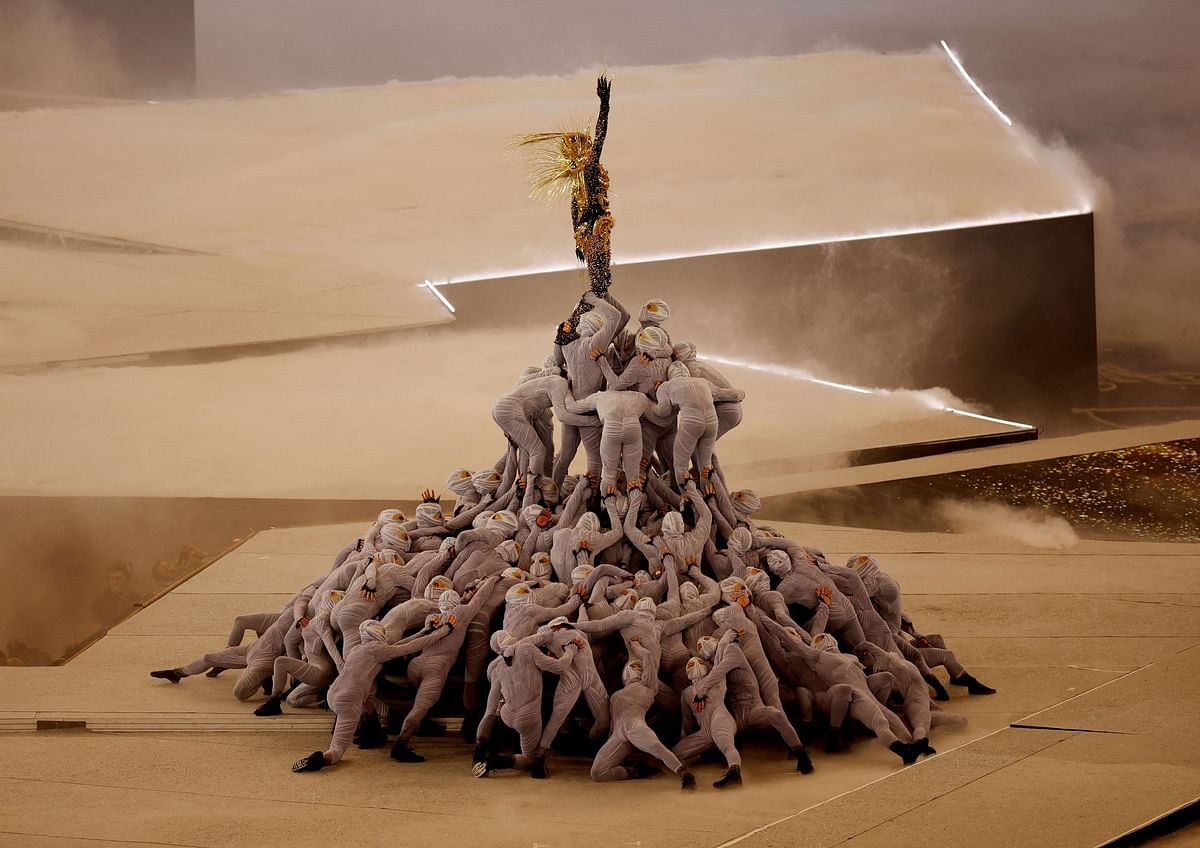 The Golden Voyager atop a pile of dancers during the closing ceremony. 