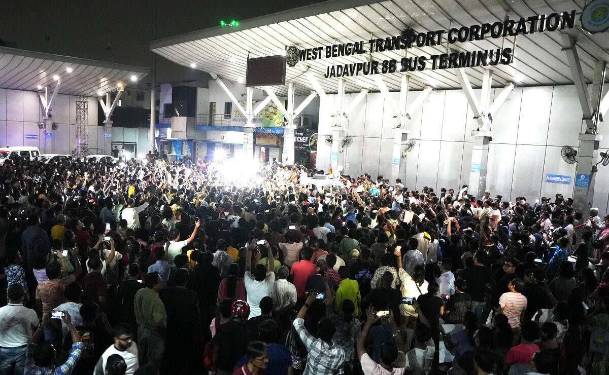 People gather at Jadavpur at mid-night on the eve of Independence Day to protest against the rape and killing of a trainee doctor at the RG Kar Medical College, in Kolkata.