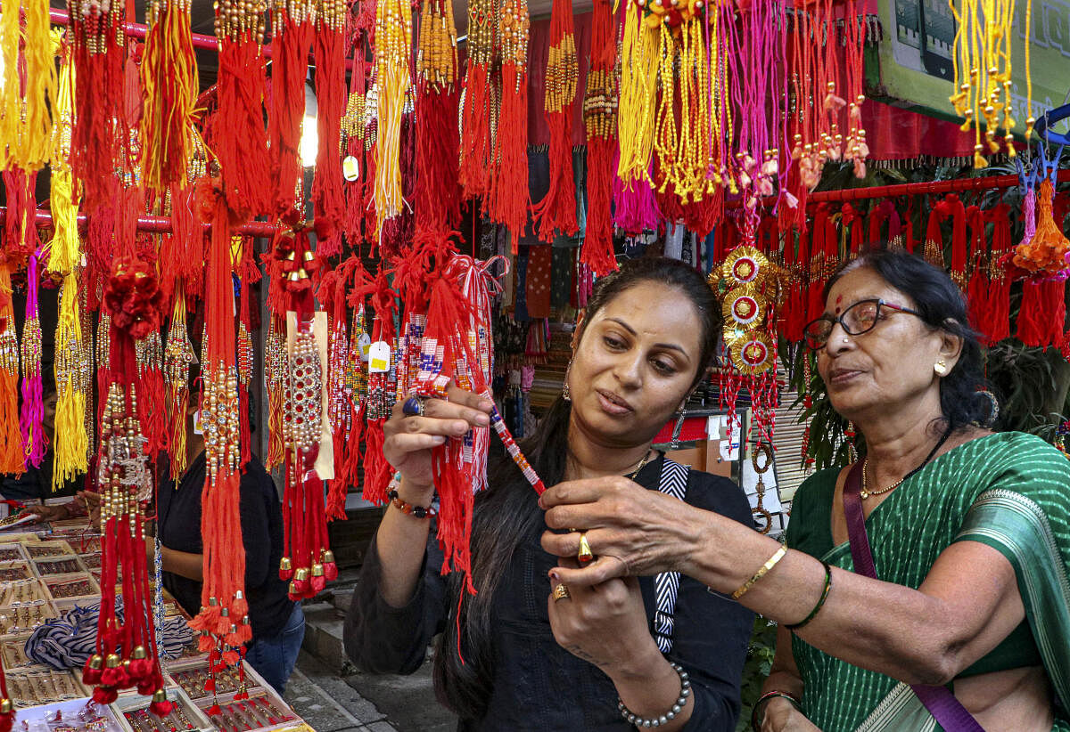 Women purchase 'rakhis' ahead of Raksha Bandhan festival, in Nagpur.